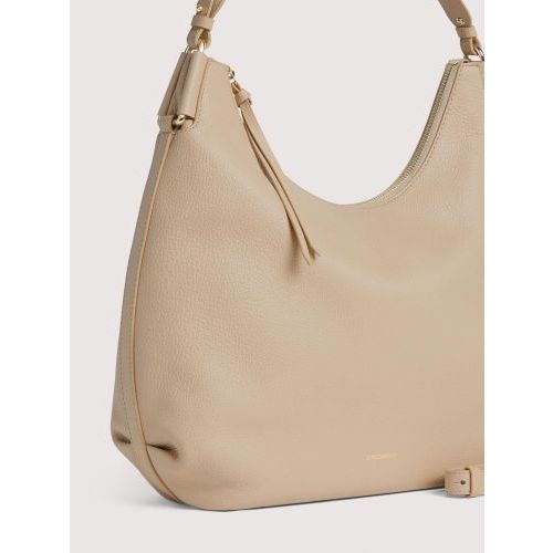 Hand-en schoudertas Coccinelle Rebekka voor dames in beige sandshell leer. 