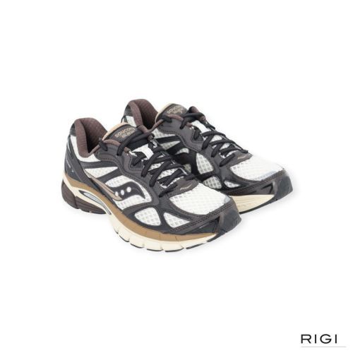 Saucony Progrid Guide 7 in bruin met wit leer voor dames. Saucony Progrid Guide 7 in bruin met wit leer voor dames.